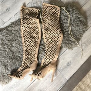 Peeped row, thigh high, suede heels.